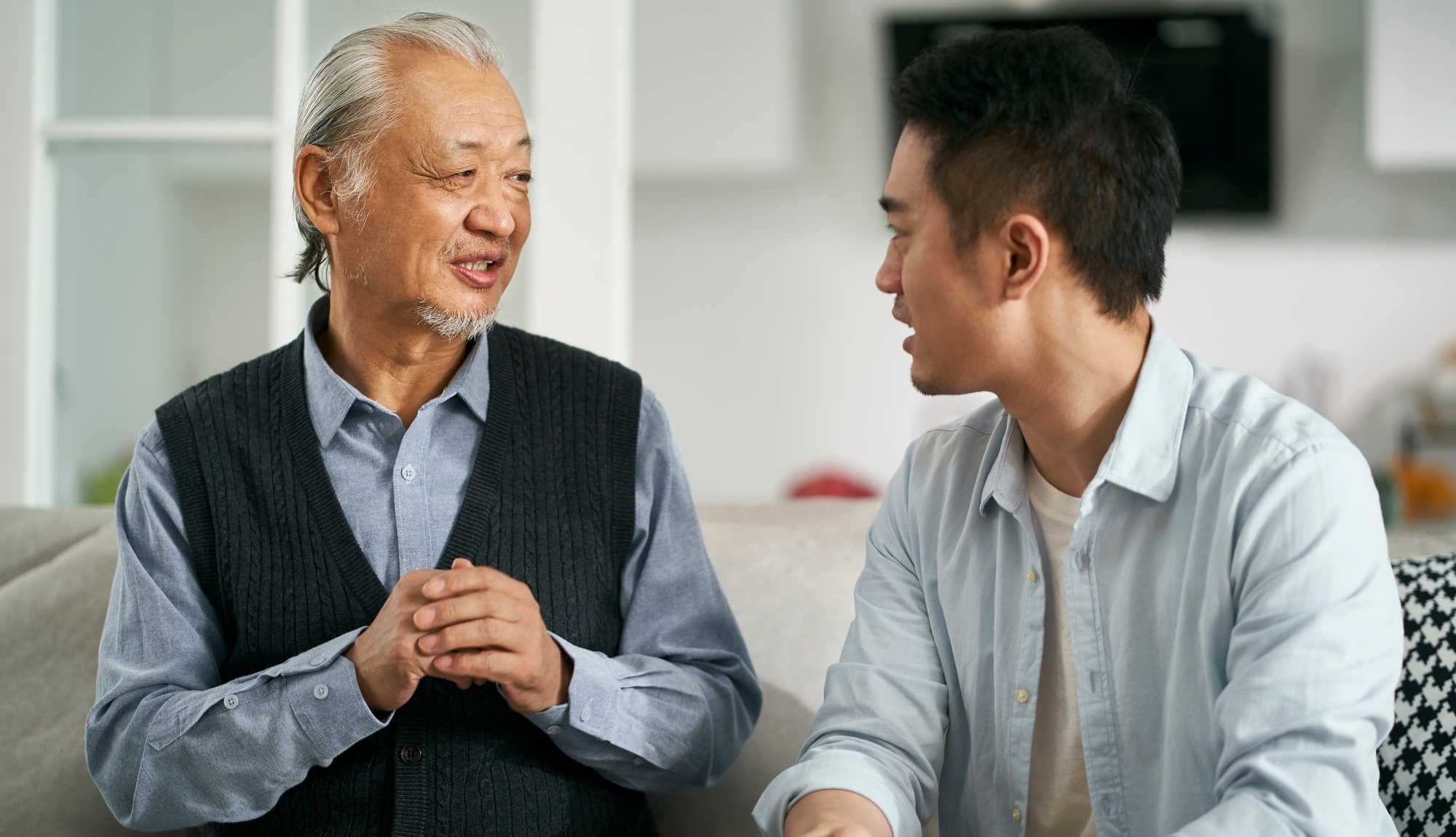 A young man talking to parent asbestos exposure