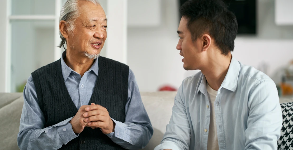 A young man talking to parent asbestos exposure