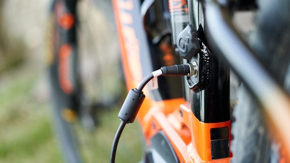 Close up of an e bike plugged in charging