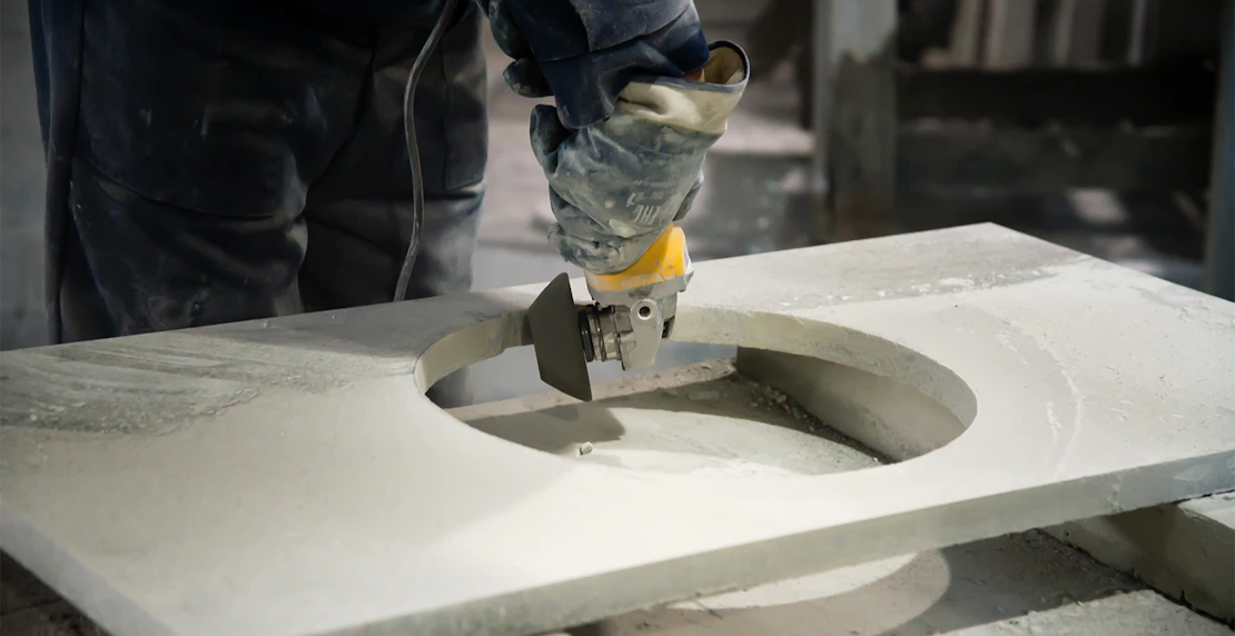 Man cutting stone bench silica resized
