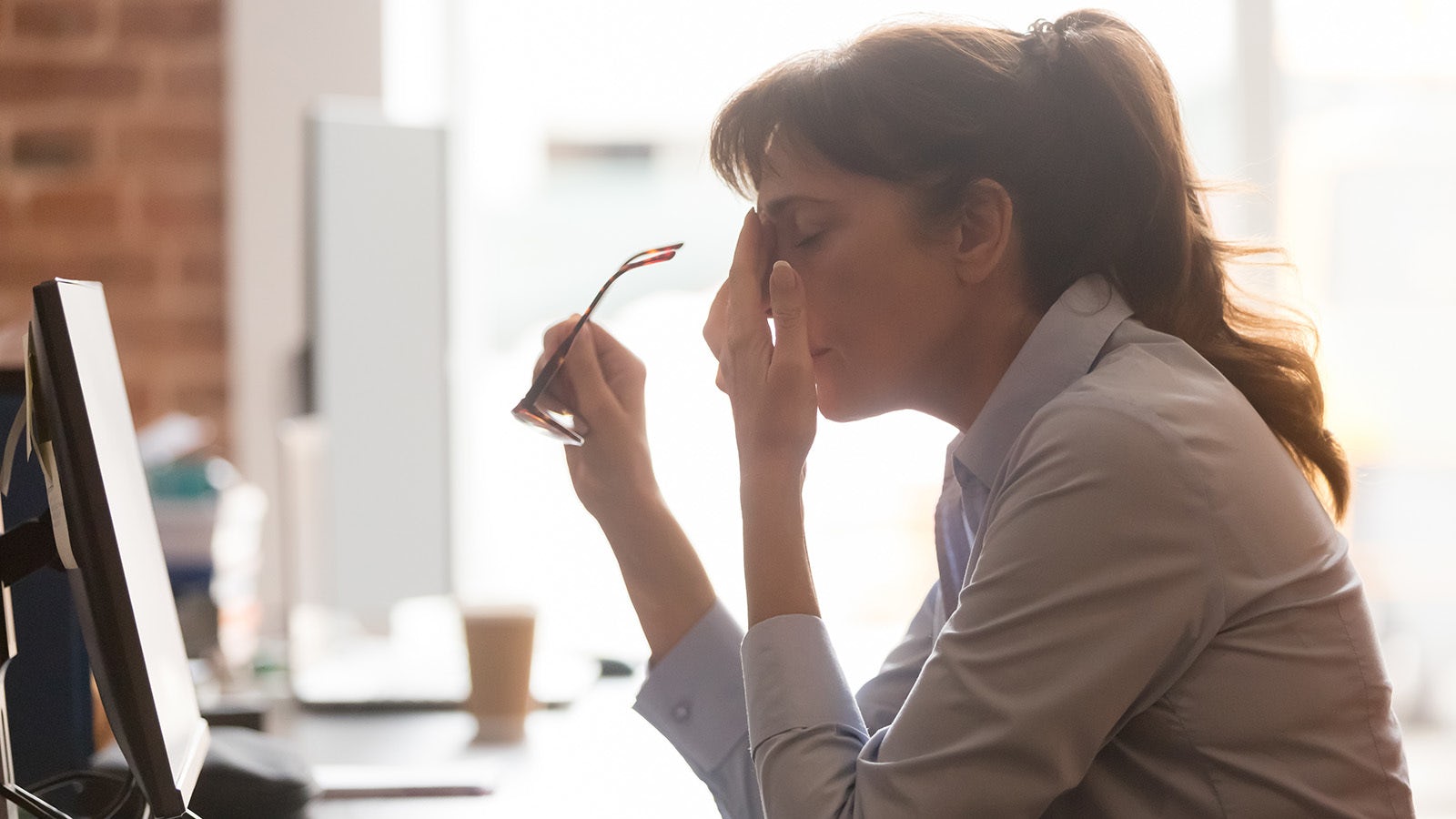 Woman tired at desk resized